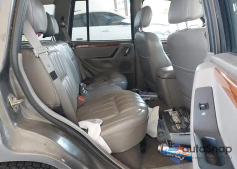 1999 Jeep Grand Cherokee Limited z USA, uszkodzony, nr VIN 1J4GW68N0XC512229